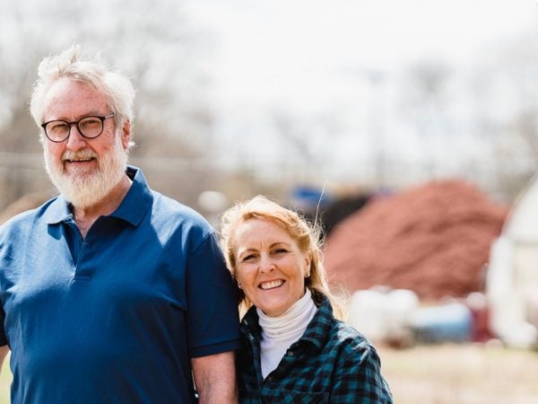 couple smiling in the fields